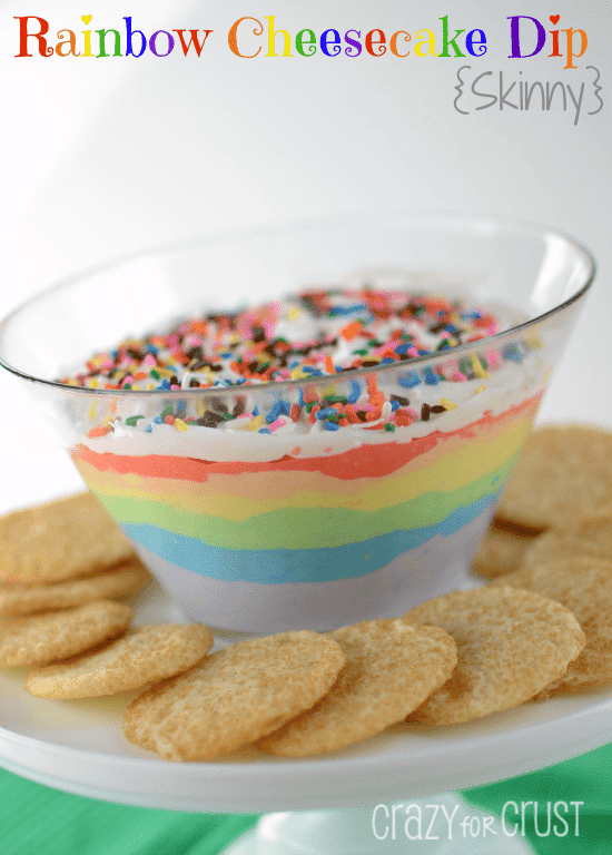 rainbow dip with cookies around on cake plate 