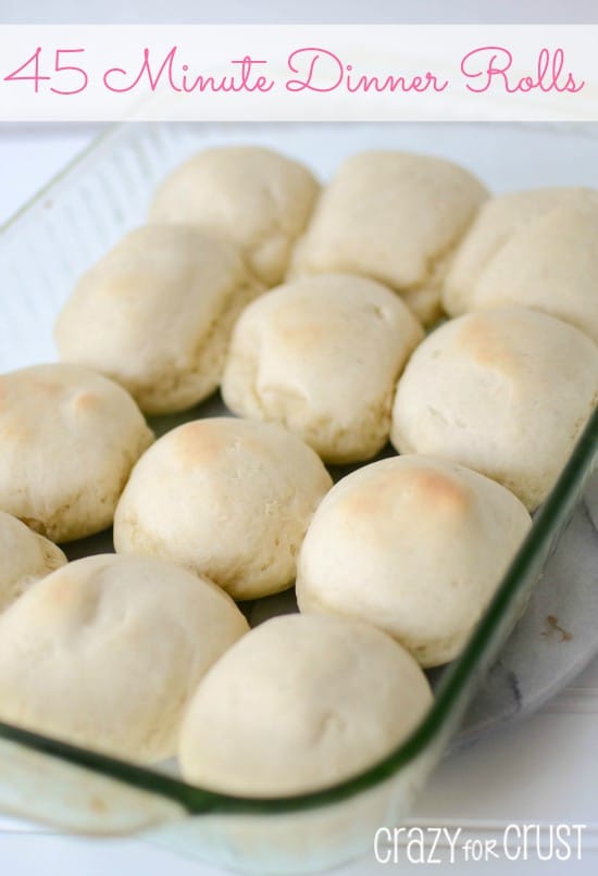 Dinner rolls in a glass baking pan with writing