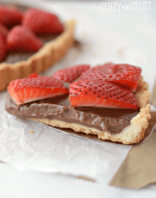 Slice of Nutella Strawberry Tart on metal spatula