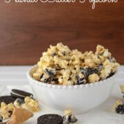 oreo peanut butter popcorn in white bowl with words on photo