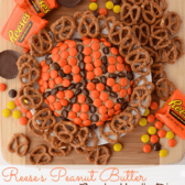 Overhead shot of Reese's basketball dip with candy and pretzels around it and text on bottom of the photo