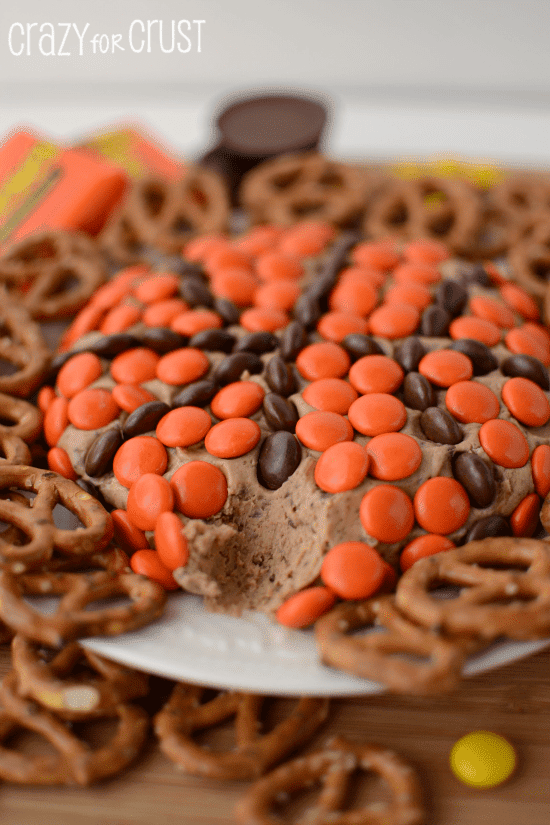 Reese's basketball dip with one bite missing and lots of pretzels for dipping