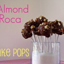 almond roca cake pops on sticks in vase with words on photo