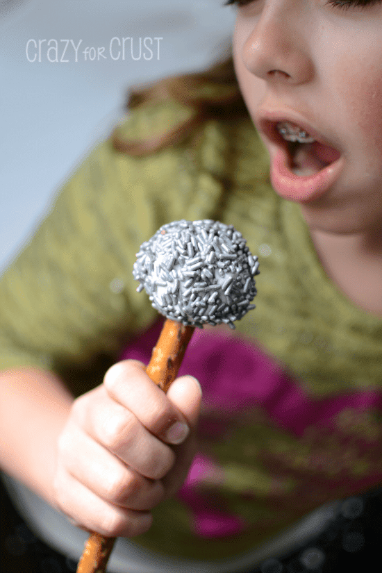 girl eating Microphone Cake Pops 