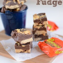 Reese's Fudge pieces in two stacks on parchment paper and wood cutting board with reese's cups and recipe title on top right corner of image