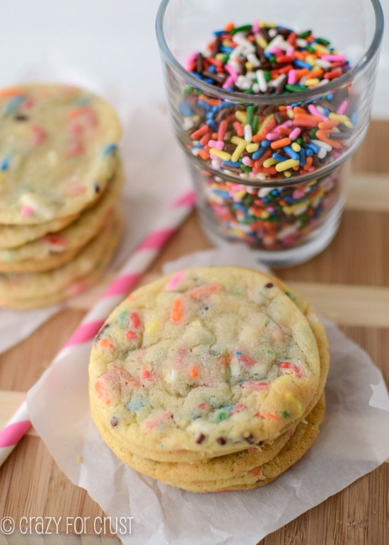 Thin Sugar Cookies in a stack on parchment paper