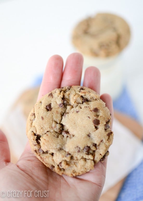 bakery-style-chocolate-chip-cookies held in a hand with title