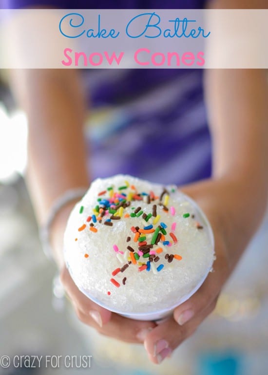 girl holding snow cone that is cake flavor