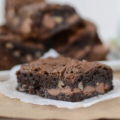 slice of chocolate cake bar with walnuts on parchment paper
