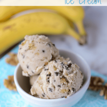 healthy banana nut ice cream in white bowl on teal napkin with bananas behind