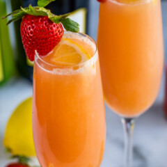 close up of lemon strawberry mimosa in flute