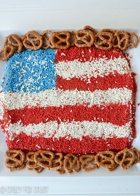 Flag dip with pretzels on a white serving dish