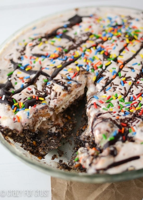ice cream pie with sprinkles and slice missing