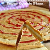peanut butter and jelly cookie pizza with slice cut