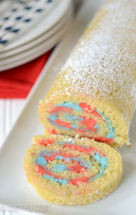 Patriotic Cake Roll by crazyforcrust.com | A fluffy vanilla cake filled with red and blue frosting!