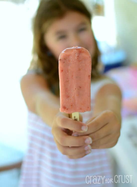 Shot of Jordan holding a popsicle with the focus on the popsicle