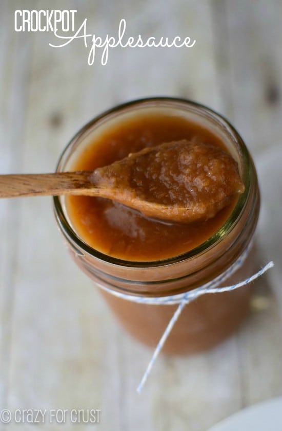 crockpot applesauce in jar with spoon