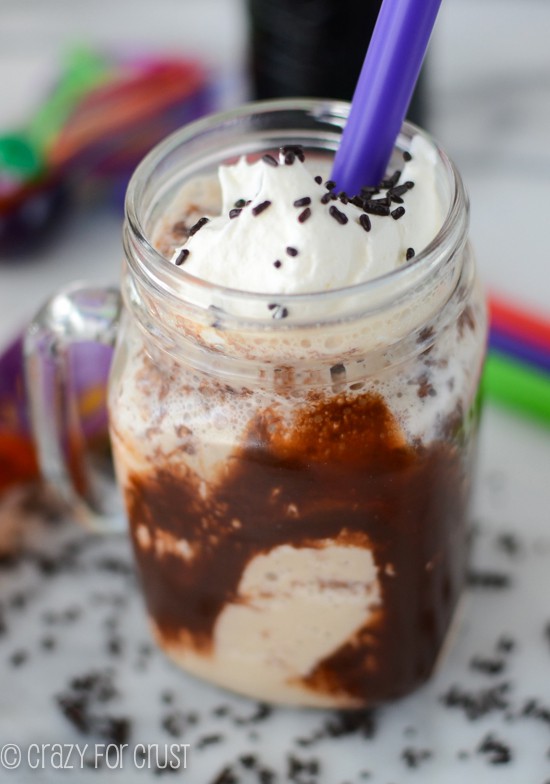 rootbeer float in jar mug with chocolate sauce and whipped cream