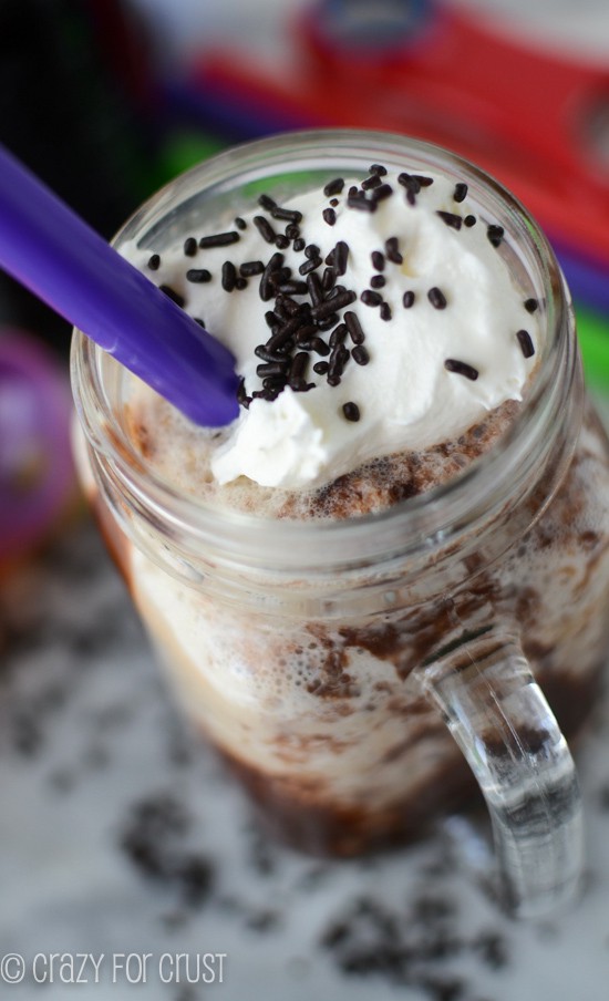 rootbeer float in jar mug with chocolate sauce and whipped cream