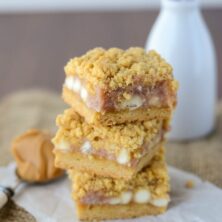 gooey bars with white chocolate and jelly in a stack