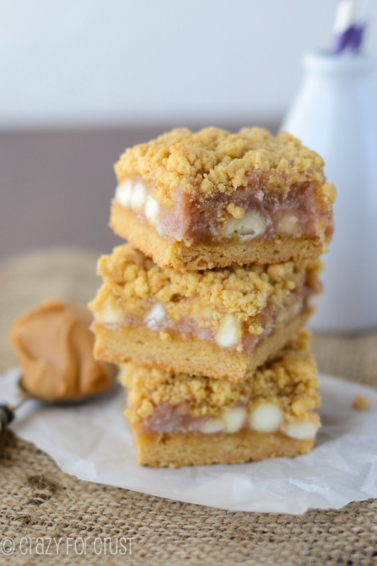 gooey bars with white chocolate and jelly in a stack