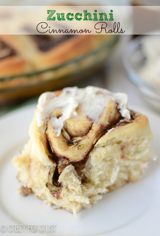 zucchini cinnamon rolls on white plate with title