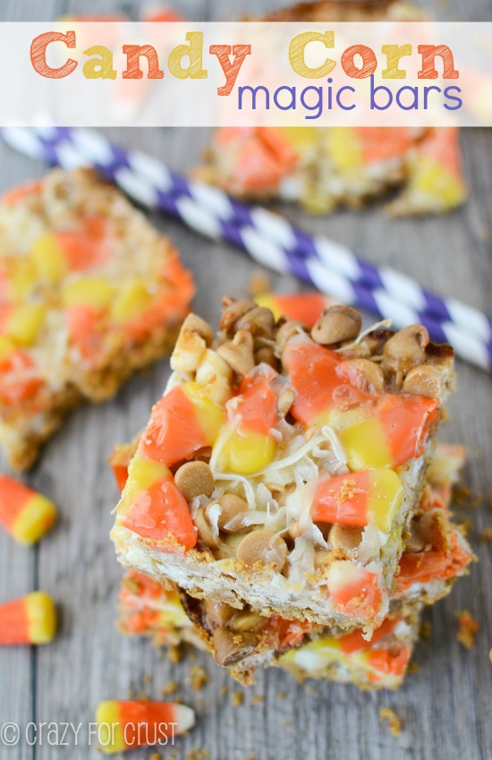 overhead shot of stack of candy corn magic bars with candy corn candy around