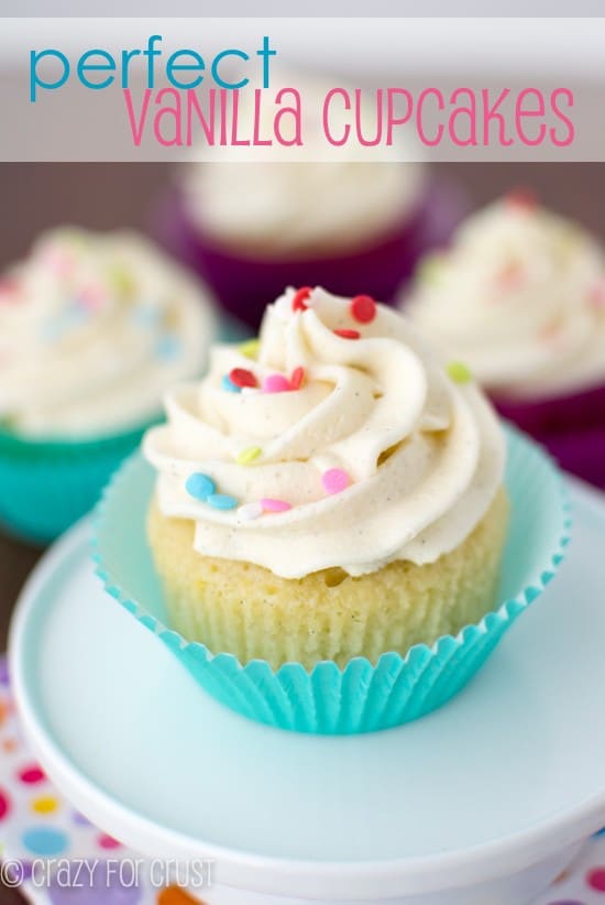 Perfect Vanilla Cupcakes in blue cupcake liner on white plate with title