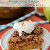 pumpkin apple dump cake slice on white plate with whipped cream