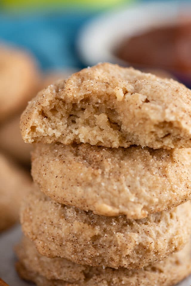 apple butter snickerdoodles in a stack with bite missing