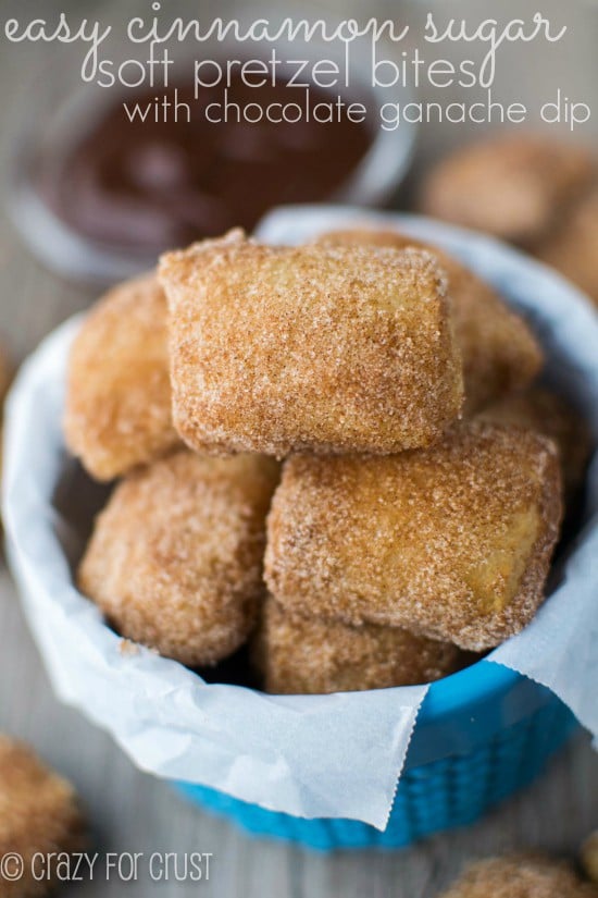 Easy Cinnamon Sugar Soft Pretzel Bites with chocolate dip on wood board with title