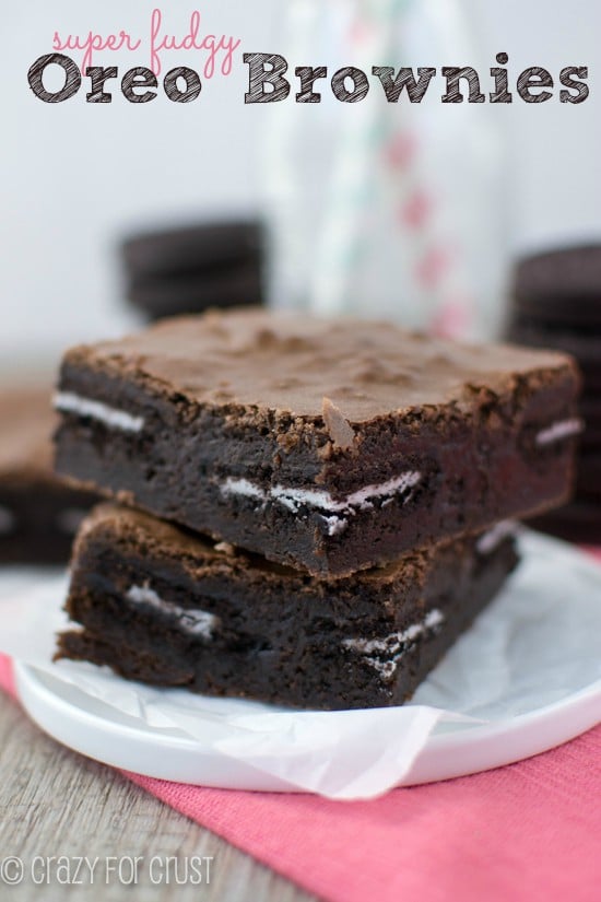 Fudgy Oreo Brownies stack on parchment paper with title