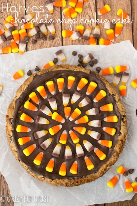 overhead shot of chocolate chip cookie cake topped with chocolate and candy corn patter with candy corn around it