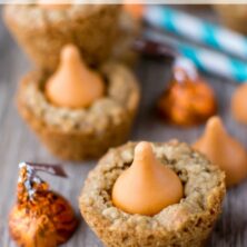 oatmeal cookie cups with a pumpkin spice kiss on top on gray table
