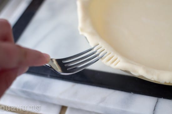 crimping an All Butter Pie Crust with a fork