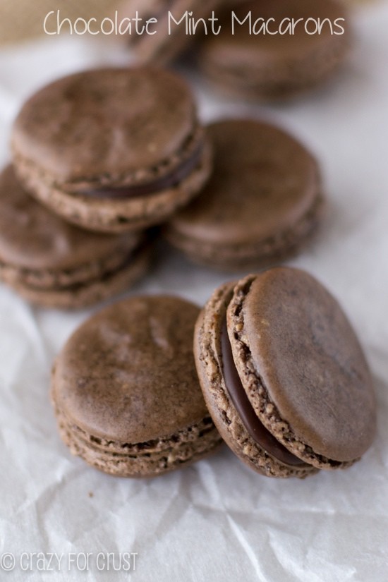 7 Chocolate Mint Macarons on white parchment paper