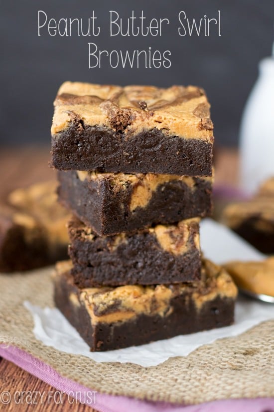 Peanut Butter Swirl Brownies stack on parchment paper with title