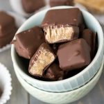 Overhead shot of butterscotch squares in white bowl with title