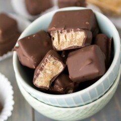 Overhead shot of butterscotch squares in white bowl with title