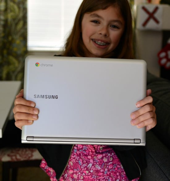 Jordan holding a Samsung Chromebook