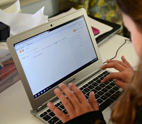 Jordan typing on her Chromebook 