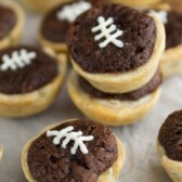 mini pies with crust and brownies inside decorated to look like footballs