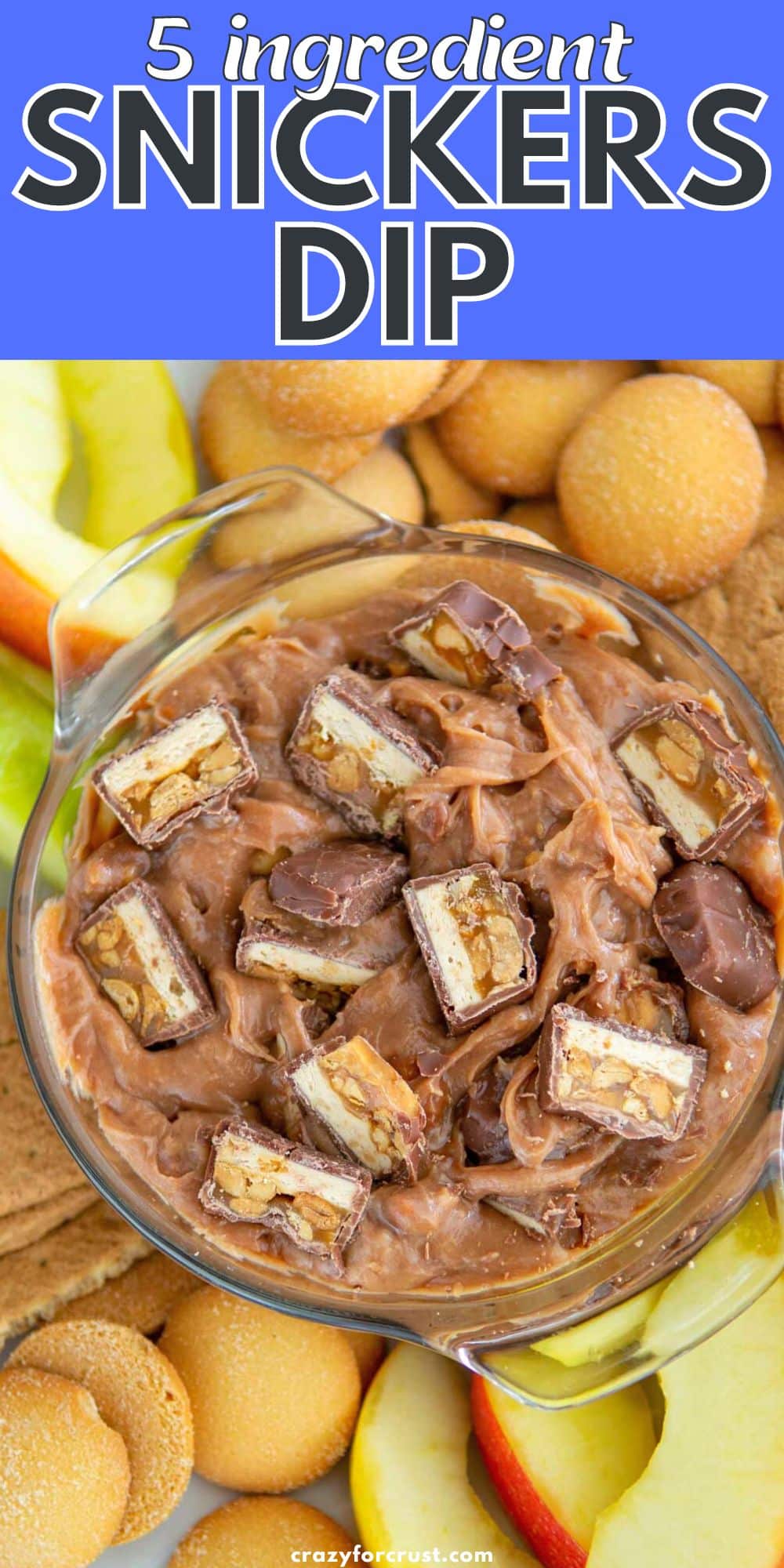 bowl of dip with snickers and an apple slice