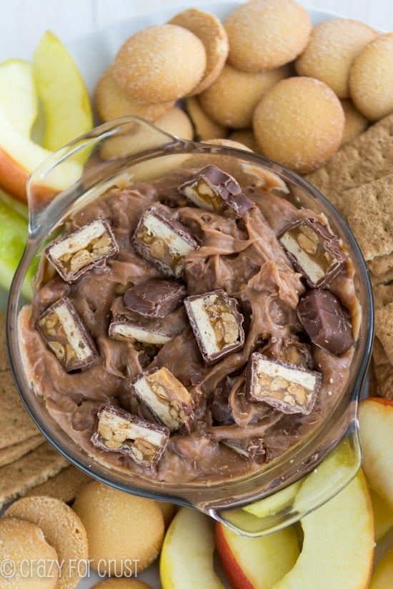 Overhead shot of snicker dip with apples and cookies 