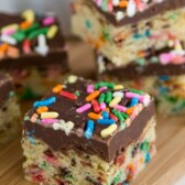 funfetti cookie bars with fudge topping and sprinkles