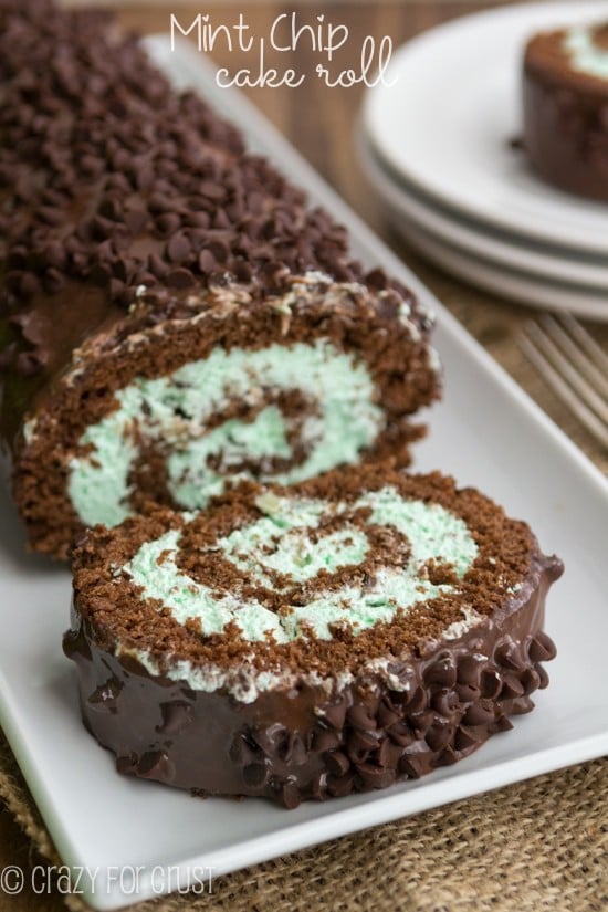chocolate cake roll with green mint chip filling on white platter