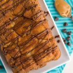 overhead shot of peanut butter monkey bread in loaf shape on white plate