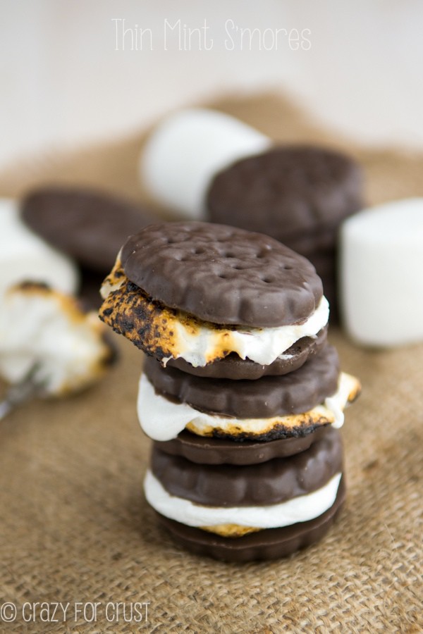 Stack of three Thin Mint S'mores on burlap with ingredients in the background