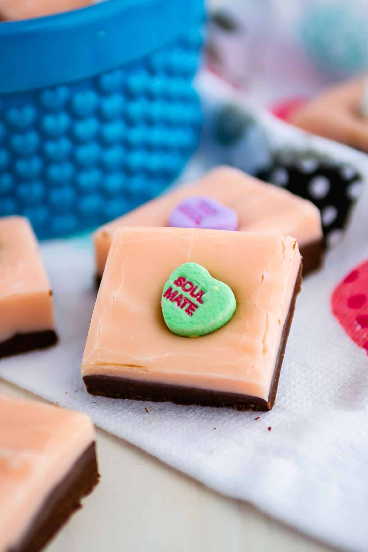 layered pink and chocolate fudge piece with conversation heart that says soul mate.