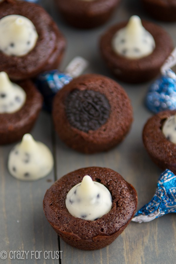 Cookies 'n Cream Brownie Bites | www.www.crazyforcrust.com | Brownie bites with an Oreo baked inside, topped with a cookies 'n cream Hershey's Kiss!